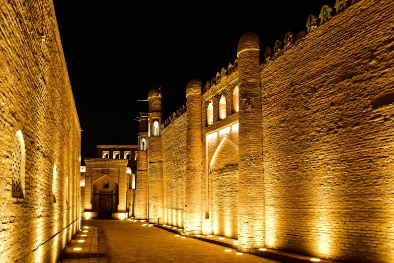 an alley with many lamps lining the walls