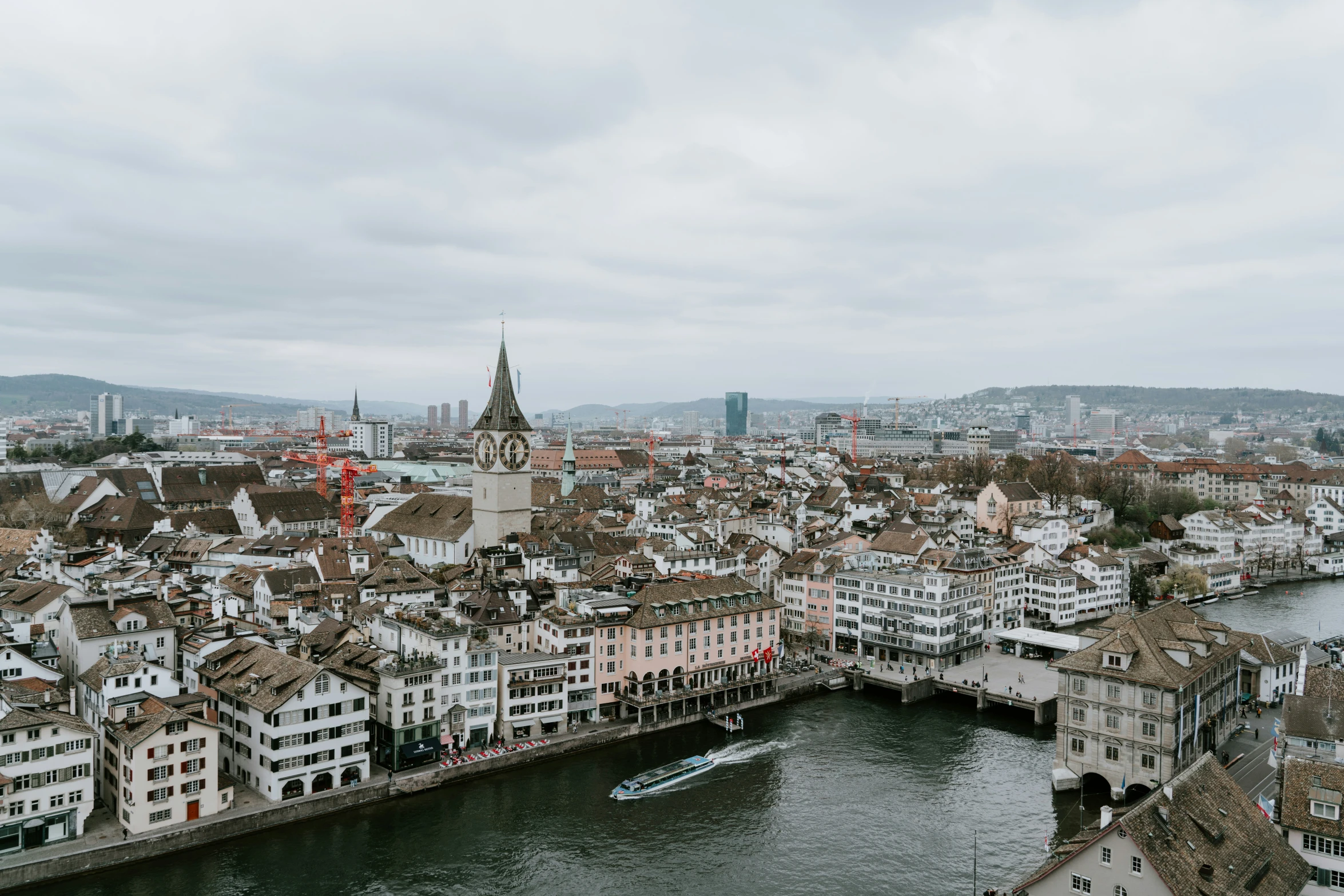 a view over the water and roofs of a city