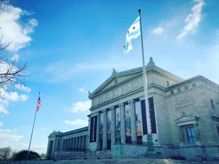 a very pretty looking building with some flags on top