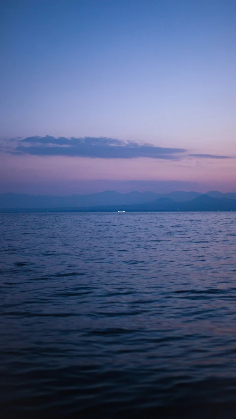 a picture taken from a boat during twilight or dusk