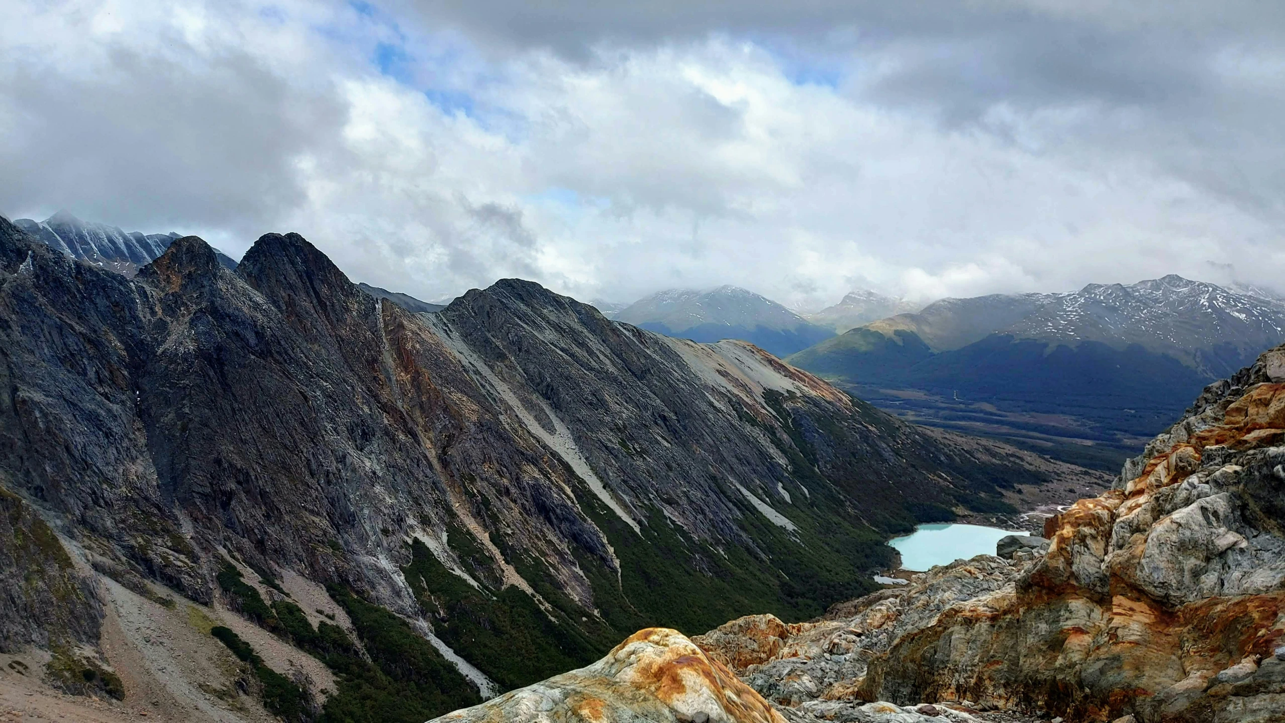 the view from a high altitude summit of mountains