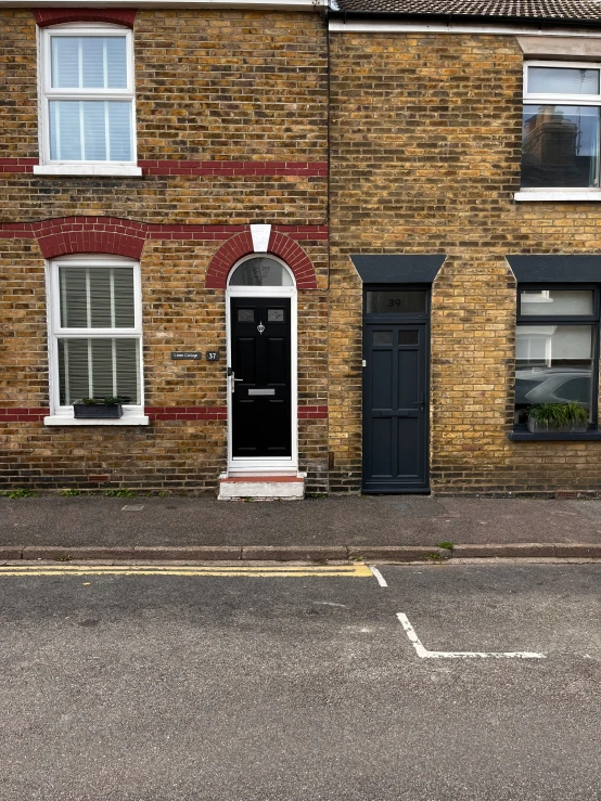 a tall brick building on a city street