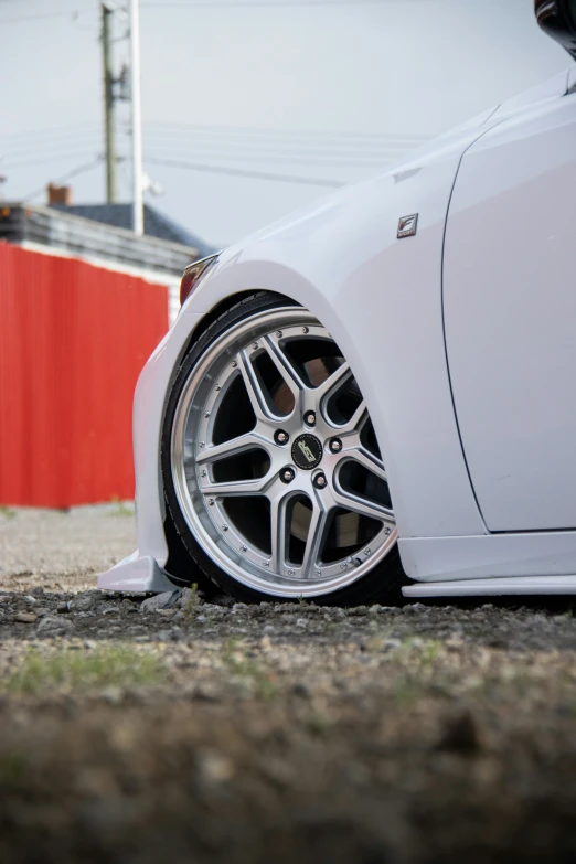 a car with its ke rim and wheels on the ground