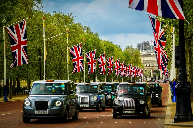 a group of vehicles that are sitting in the street