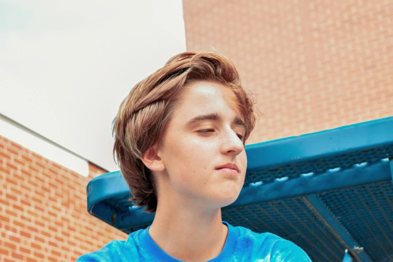 a close up of a person wearing a tie dye shirt