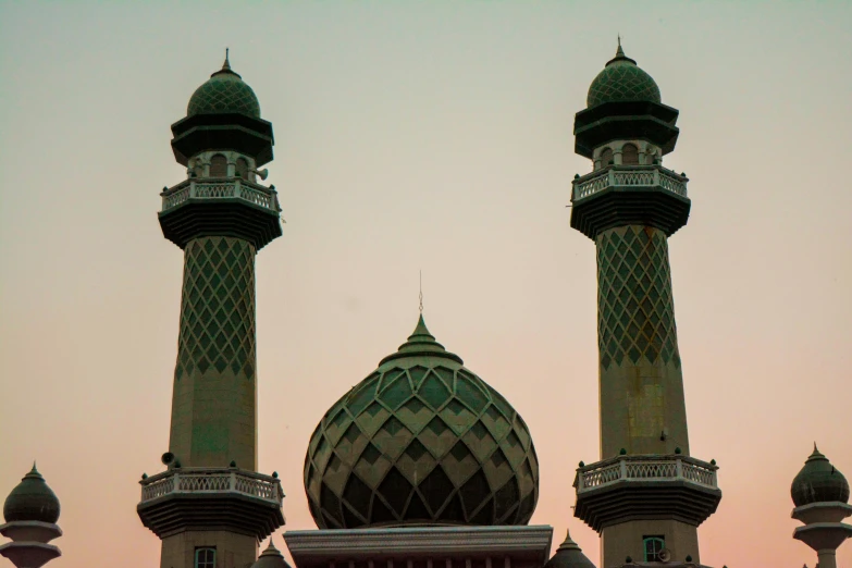 a couple of very tall buildings with pointed roofs