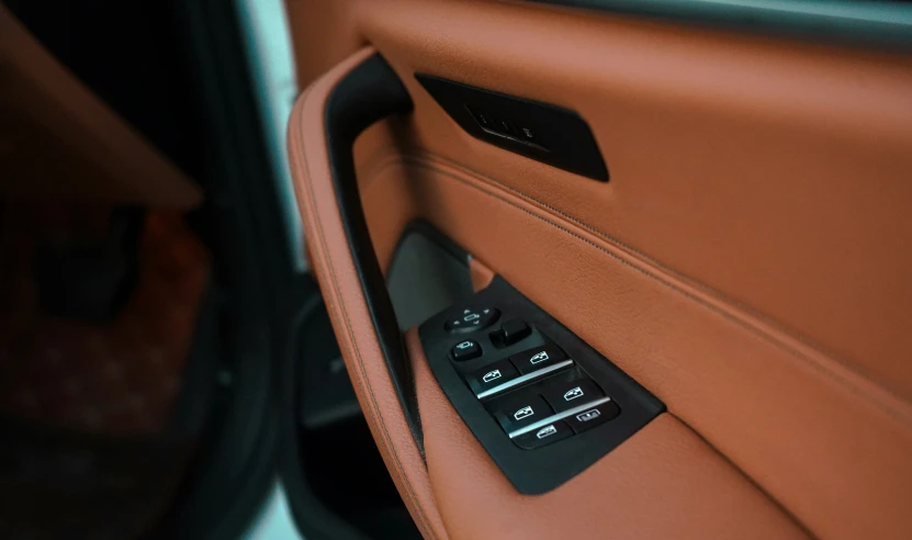 an orange leather door panel sitting next to a doorway