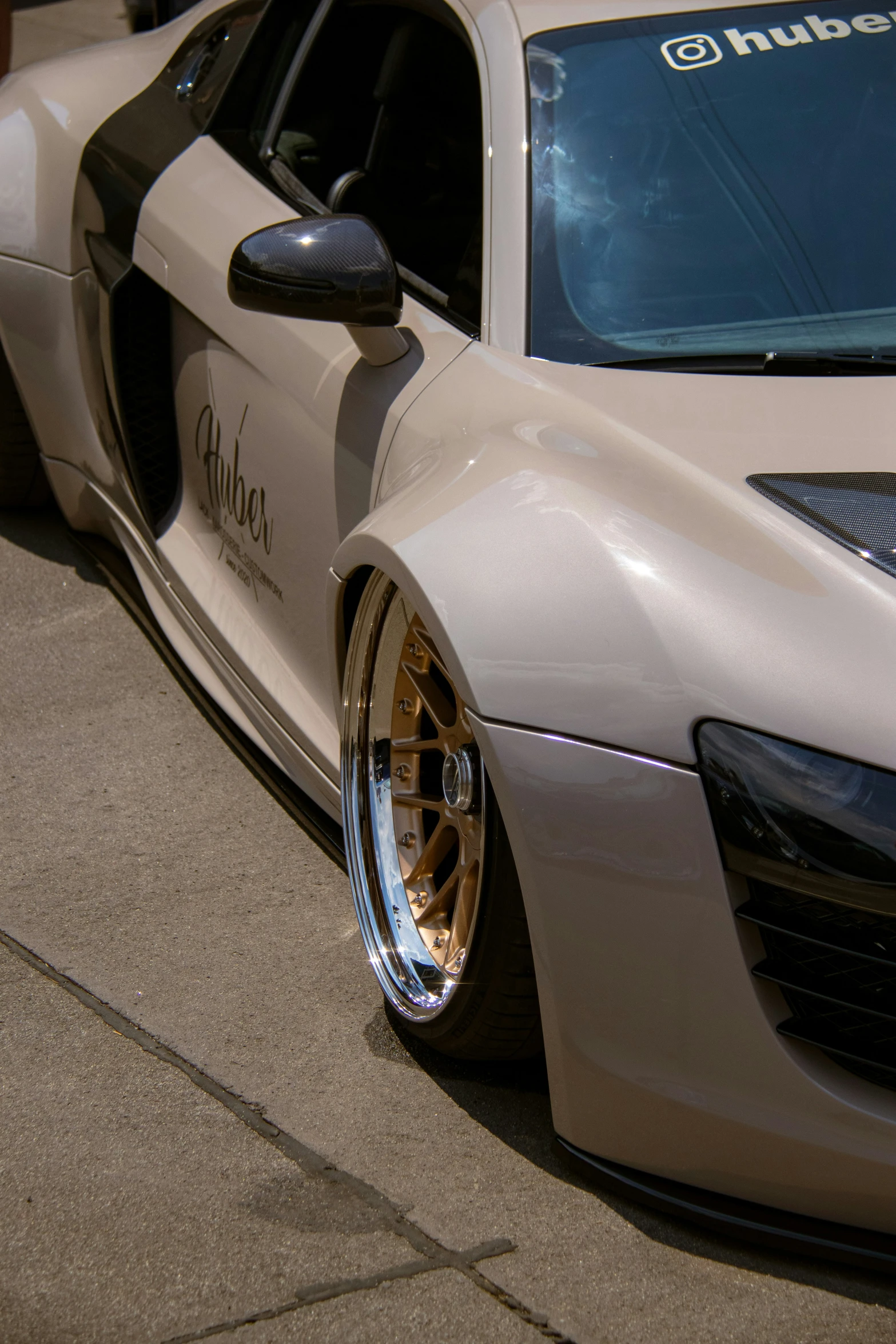 the front of an automobile parked on the side of the road