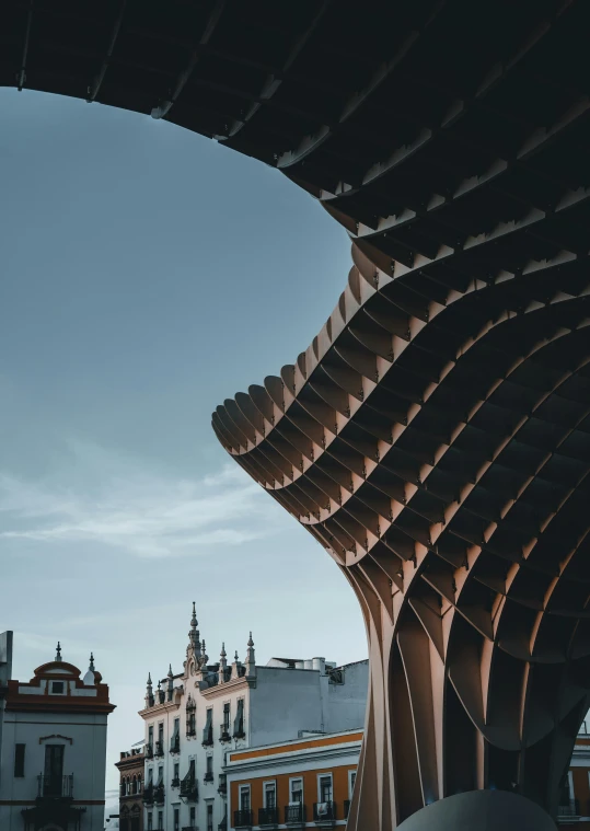 looking up from underneath a walkway towards the cathedral in a city