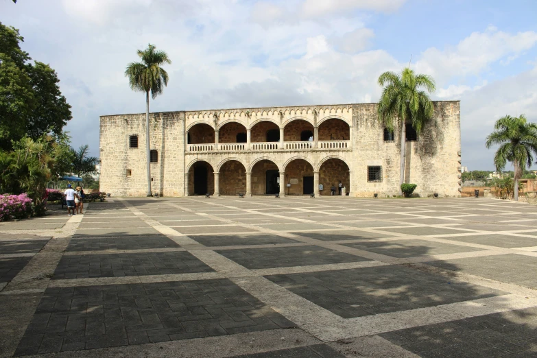 two large building in the middle of a pavement