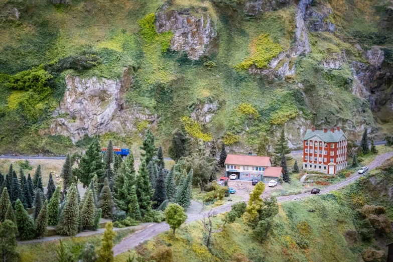 aerial view of a village nestled on a green hillside