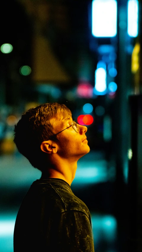 a man standing at a curb looking away