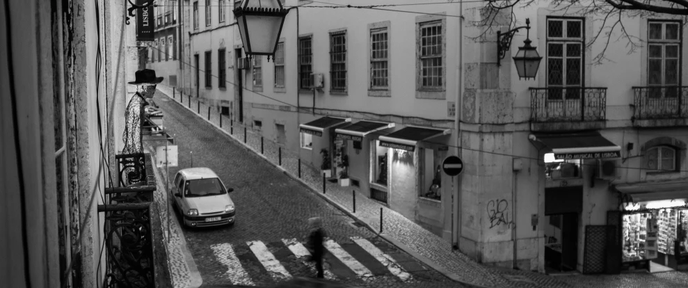 the street is wet with rain, and it looks like this city had no people