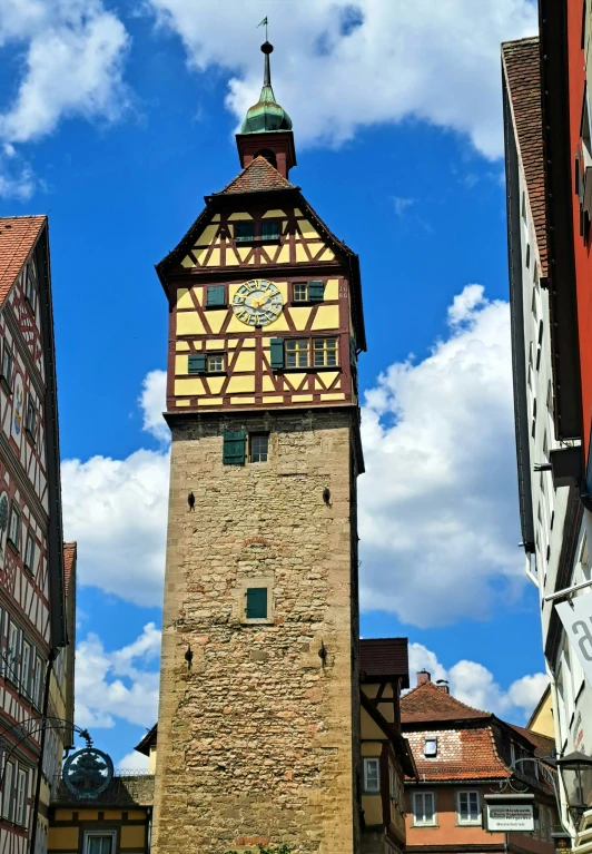 the clock tower is on top of a building