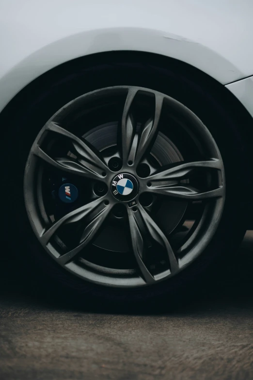 a car with several black spokes is seen