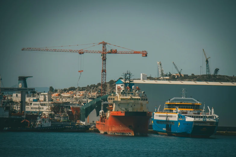 two large boats are docked next to the shore