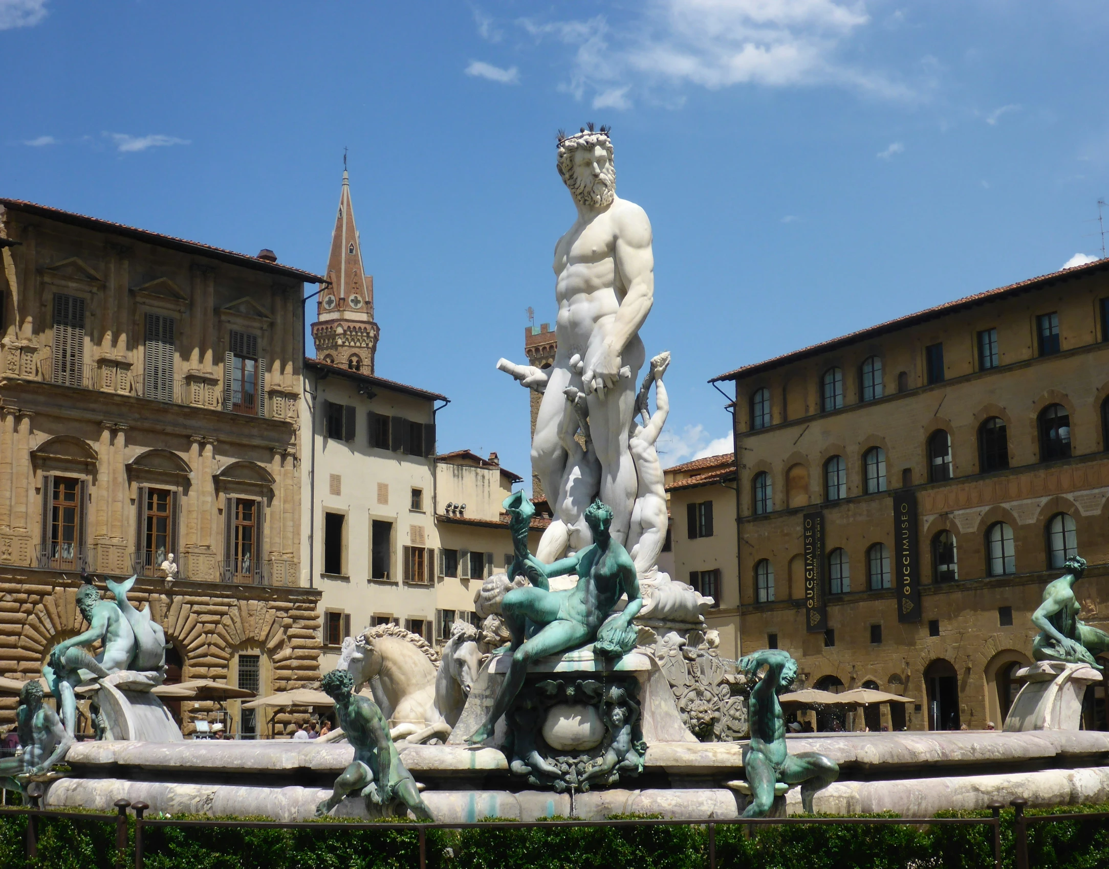 a large white fountain with lots of water fountains