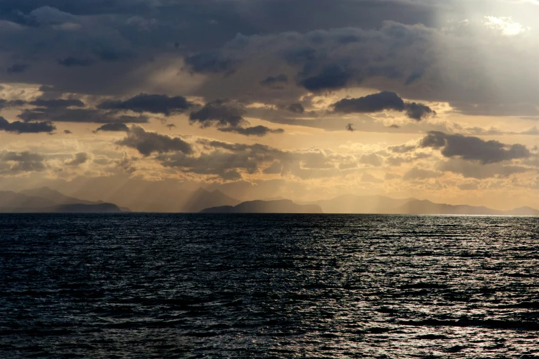 a couple of large islands under cloudy skies