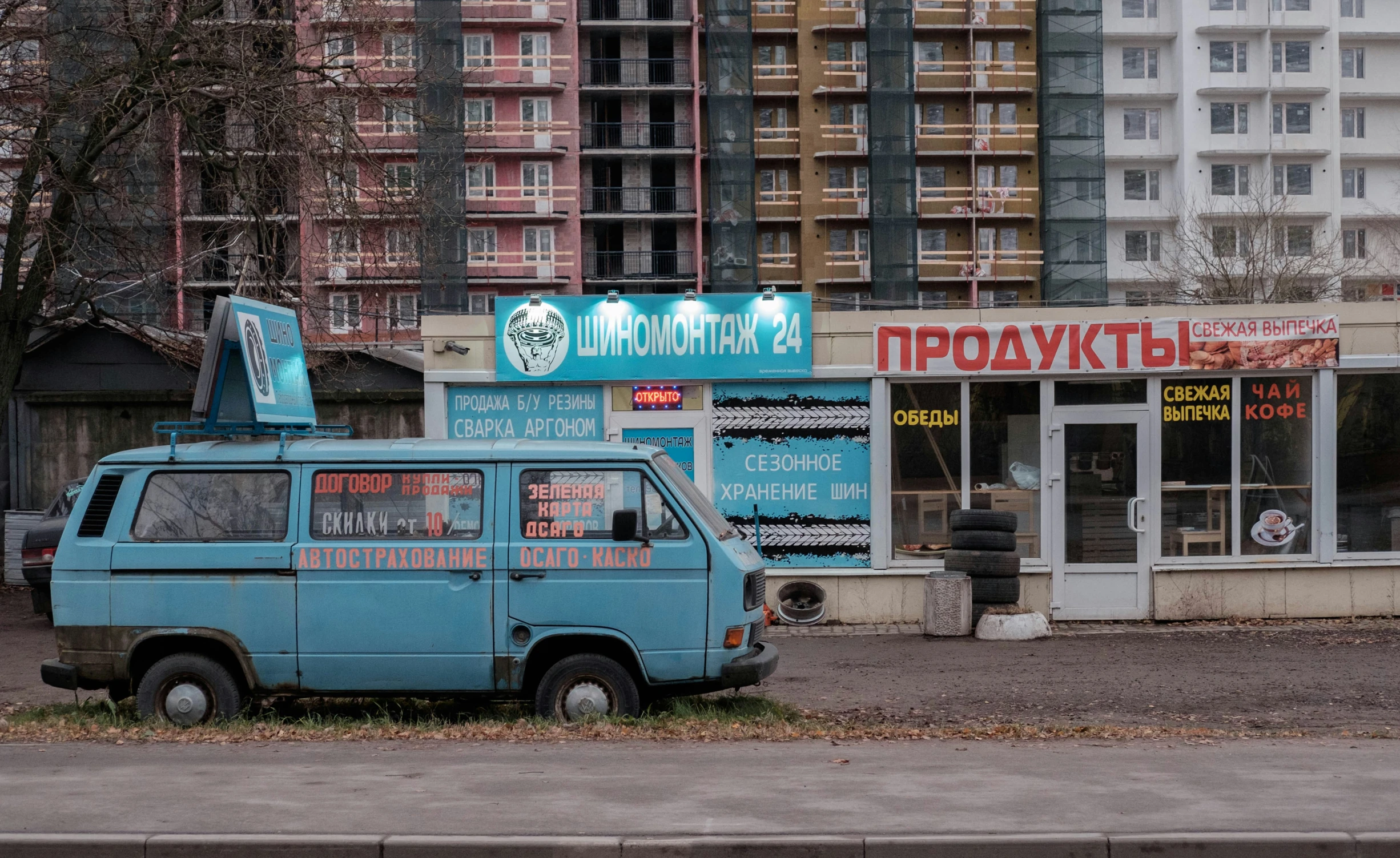 a small van is parked in front of a fast food store