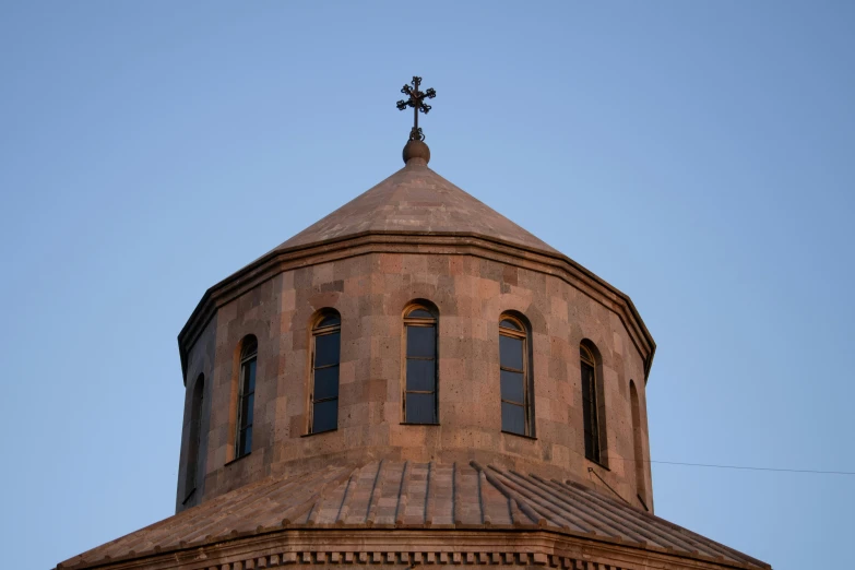 a round building with a cross atop the top