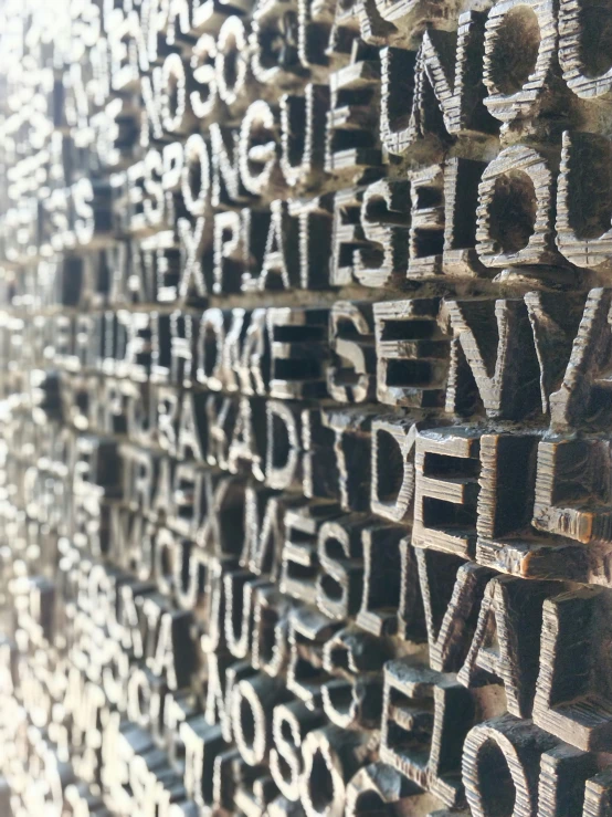 an array of writing displayed on display in a wall