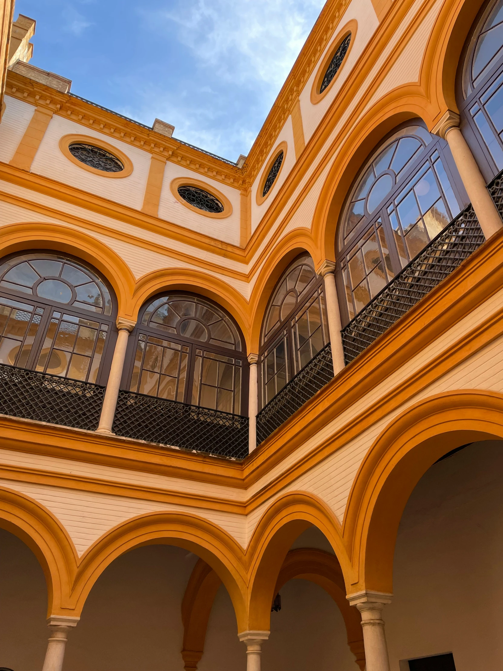 the inside of an ornate building has arches and arched windows