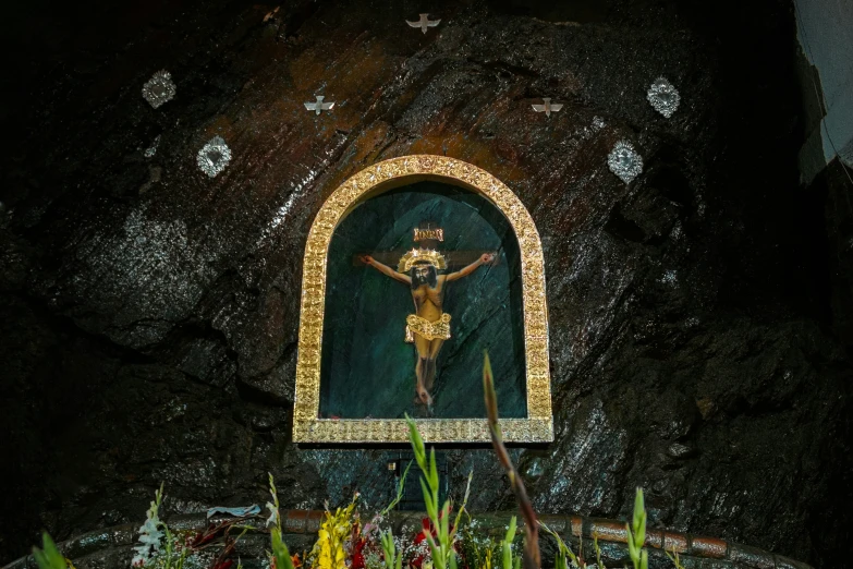 a shrine with a crucifix painted on it