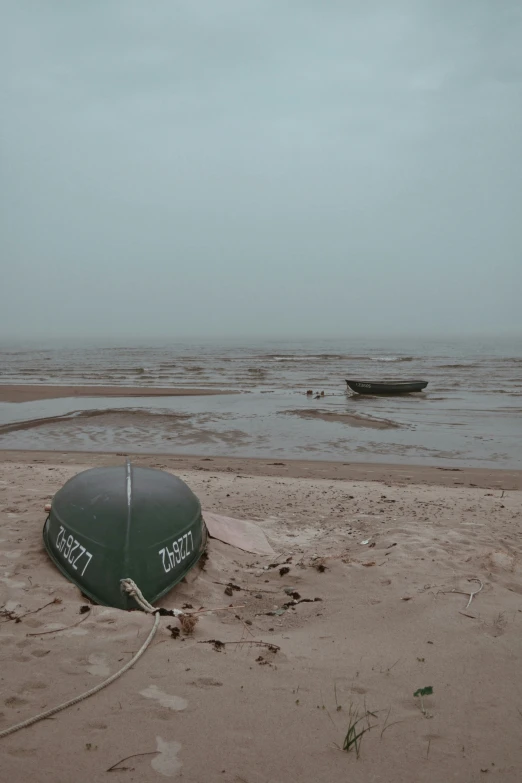 there is a boat out on the shore and a rope attached