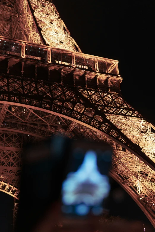 the eiffel tower is illuminated in red, white and blue