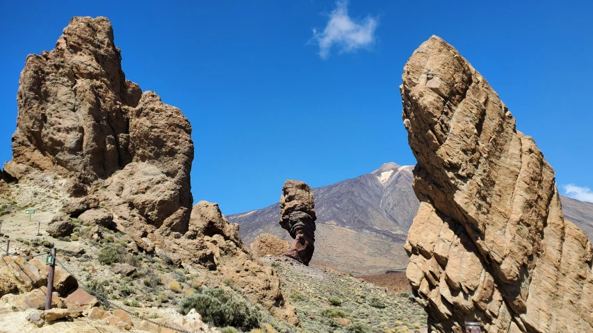 an image of people climbing the rocks in the mountains