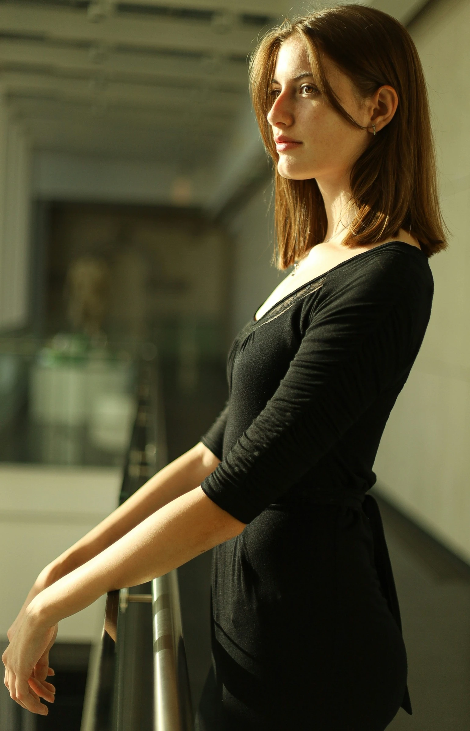 a woman standing on top of a railing