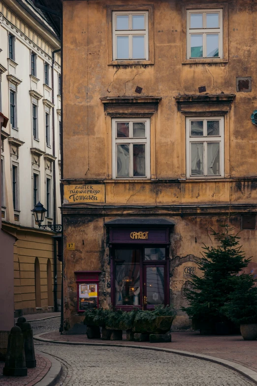 an old building is shown with a street sign in the window