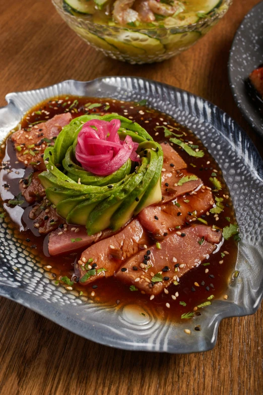 a plate of food and spoons on top of a table