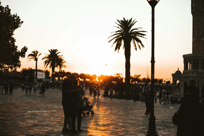 a crowd of people and some street lights