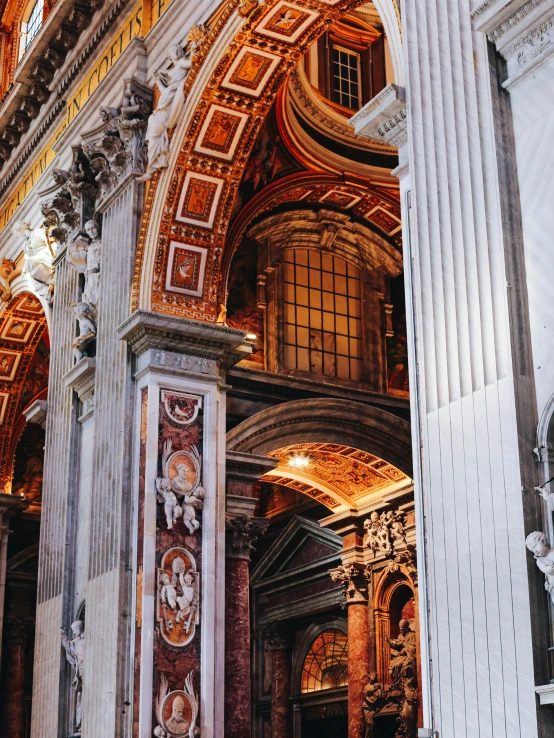 the front entrance to a cathedral with columns and arches