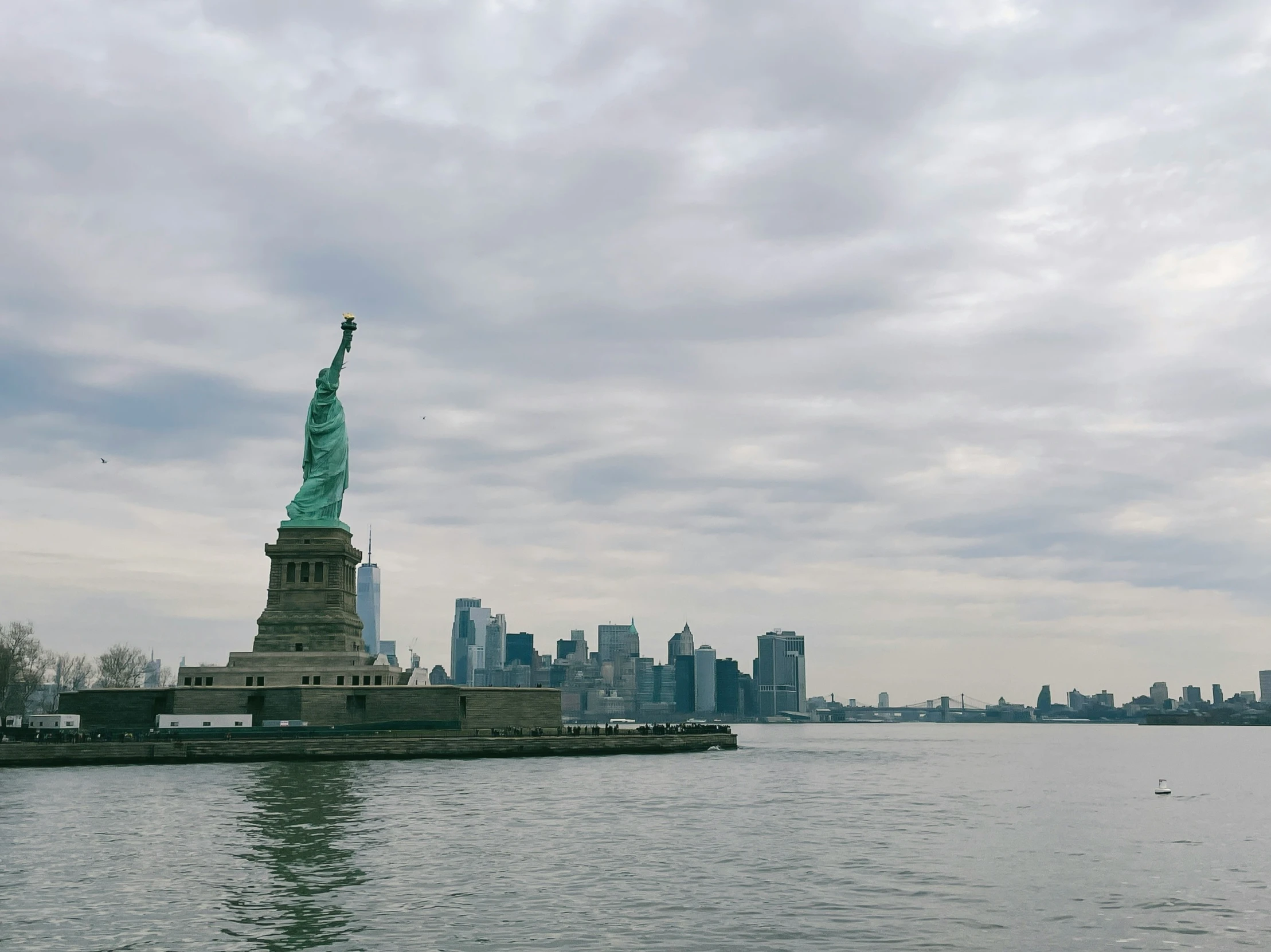 the statue of liberty is by the water