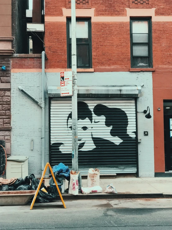 a street view of an urban building with a painted mural