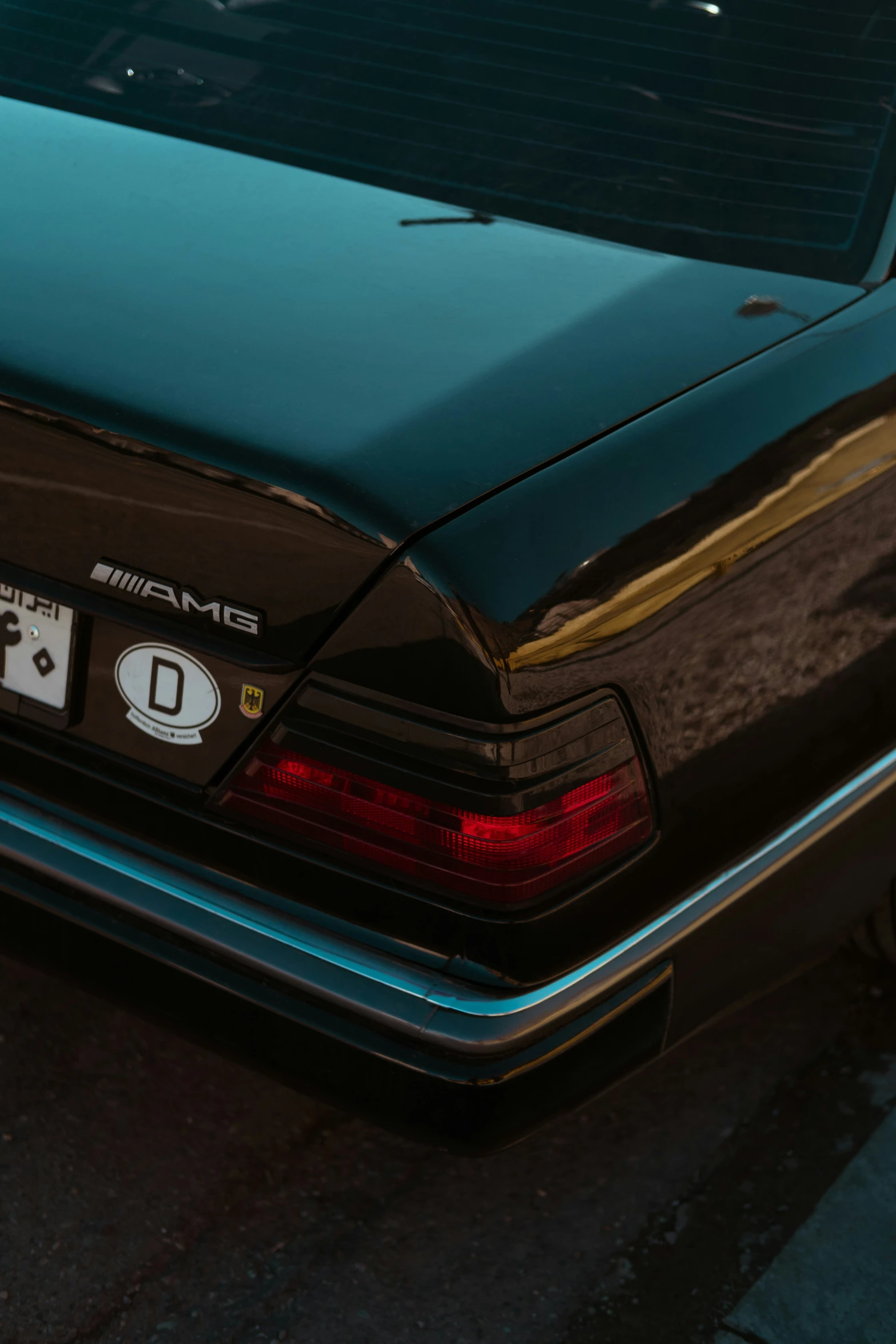 a close up of a car parked in the road