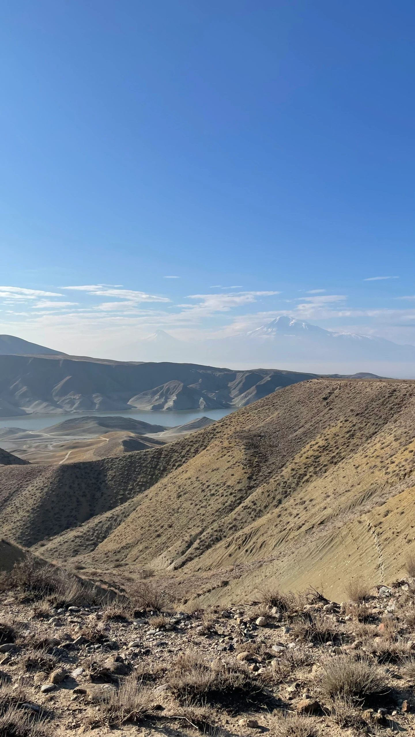 the distant landscape looks great with a lake in the distance