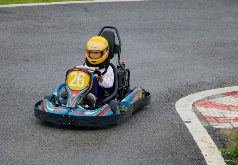 a  in a go kart with number 26 on the side