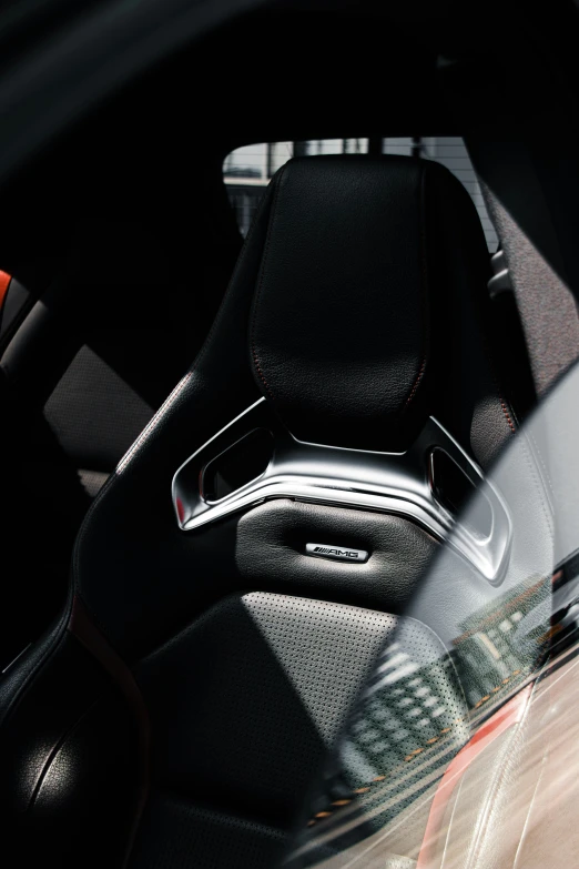 the interior of a car with a black leather trimmed front seat