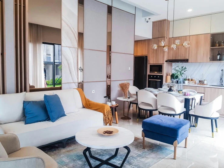 a living room with a blue and white chair