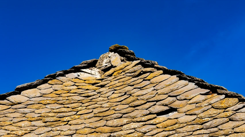 there is a po that looks like it has rocks and a blue sky in the background