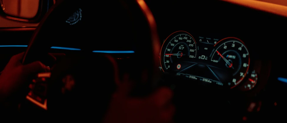 interior view of a car with the illuminated dashboard