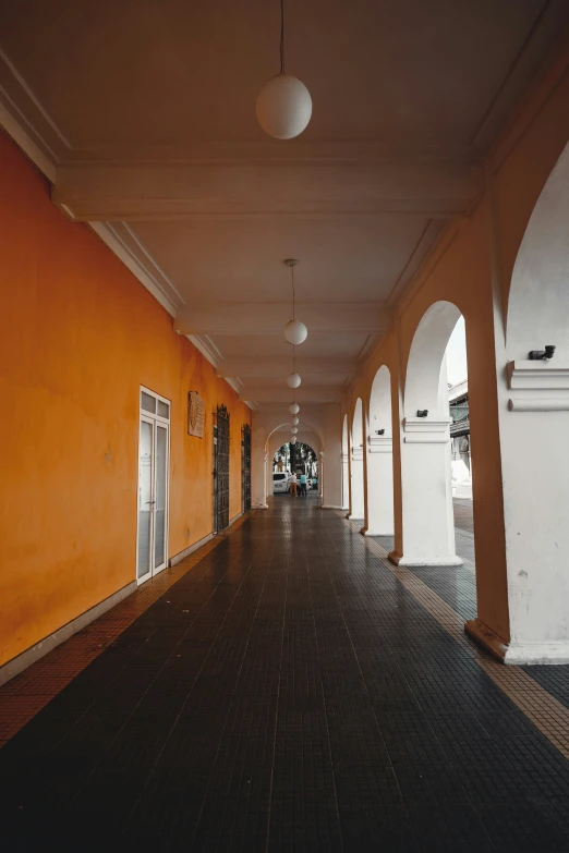 a long corridor with a few lights on it