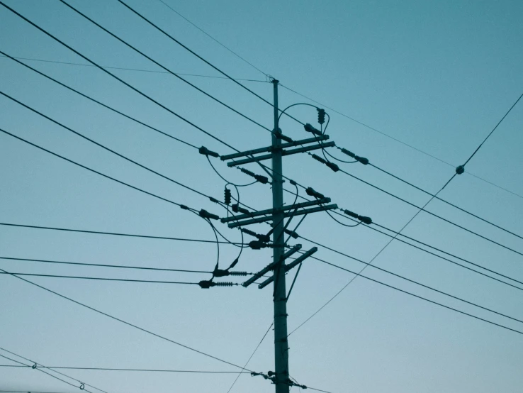 high - voltage electric lines with blue sky background