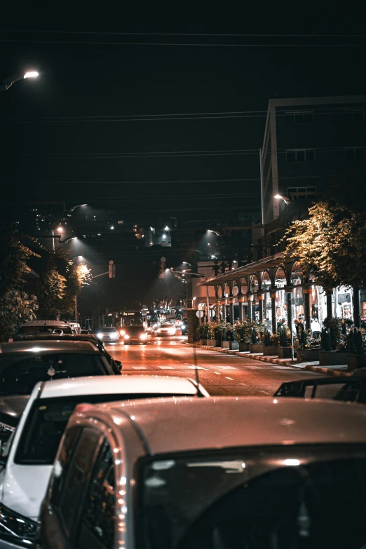 some cars on a street at night time