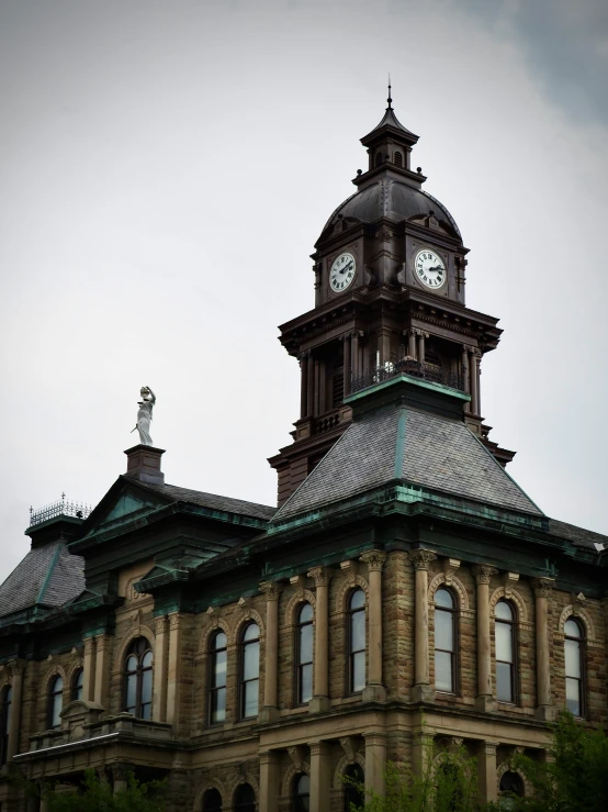 a building with a clock on it is on a cloudy day