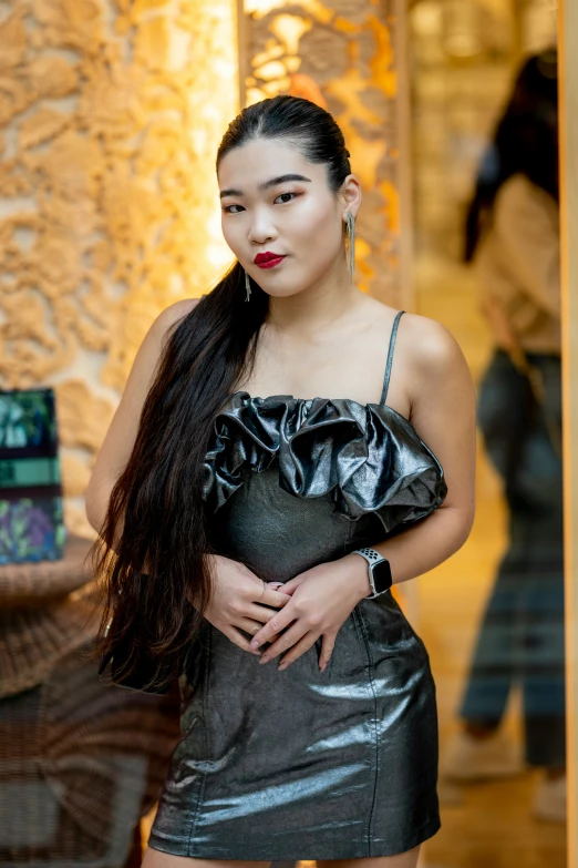 a woman standing next to a sculpture of a bear