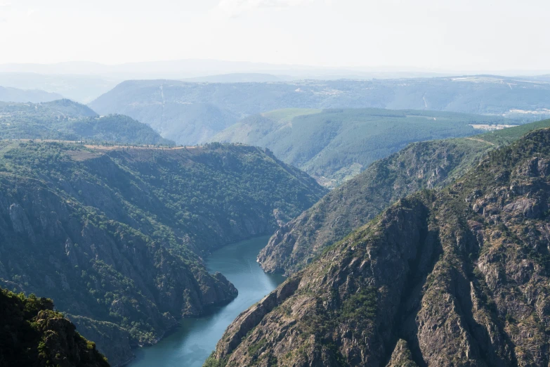 a mountain valley with a large body of water near by